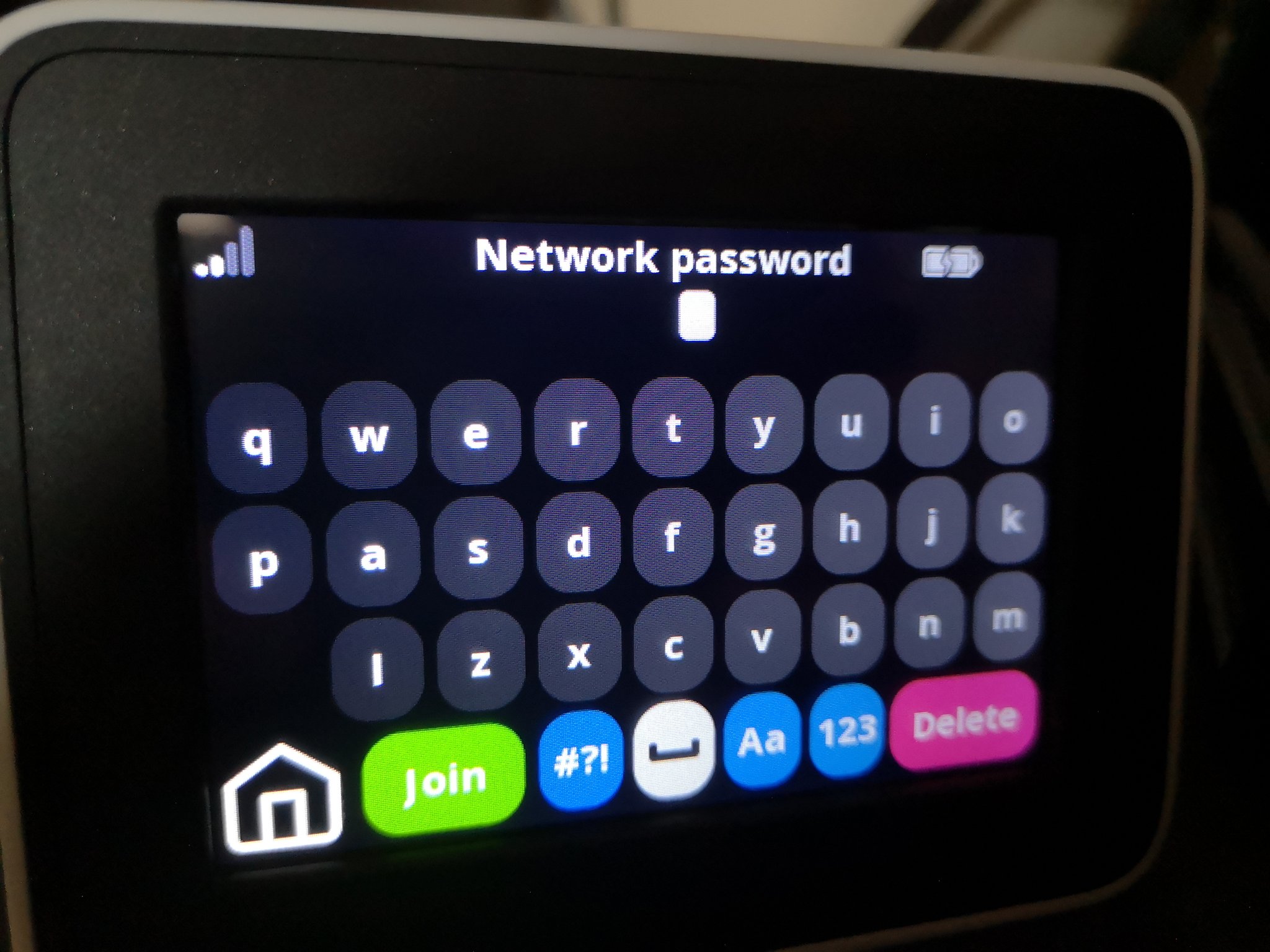 A smart meter display showing a butchered ‘qwerty’ keyboard to input a wifi password (source: @cabe_bedlam)